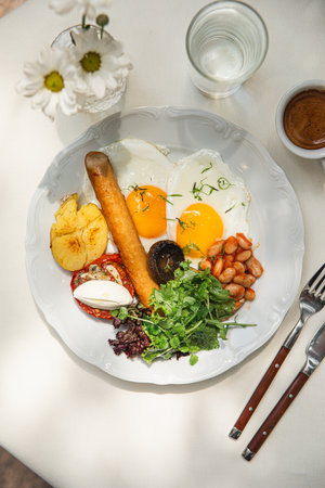 Portion of breakfast with sausage and fried eggsの写真素材