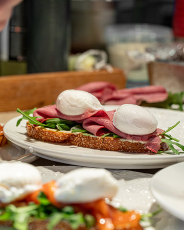 Bruschetta with pastrami, arugula and poached eggs