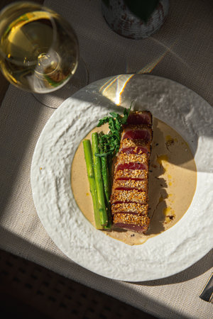 Grilled sliced tuna with asparagus and sesameの写真素材