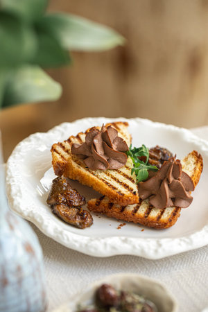 Chicken liver pate on grilled toast with fig jam