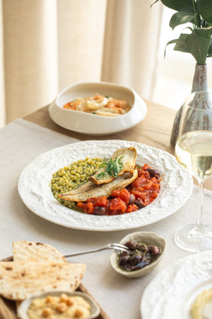 Grilled fish with vegetables and white wine