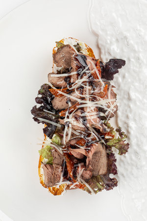 Bruschetta with roast beef and vegetablesの写真素材