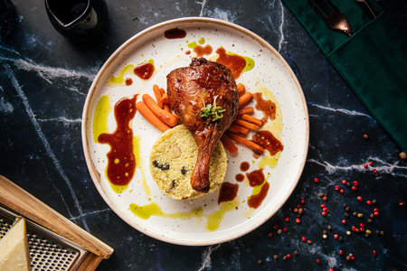Duck leg with couscous and red wine sauceの写真素材