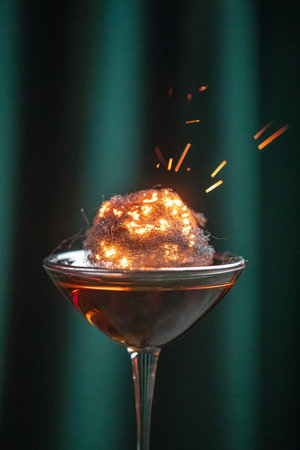 Cocktail with burning cotton candy garnishの写真素材