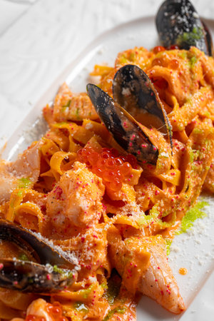 Seafood pasta with mussels and red caviarの写真素材
