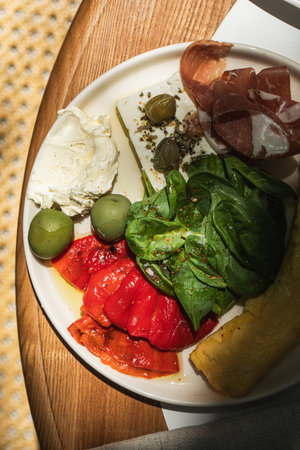 Mediterranean breakfast plate with ham and omelet