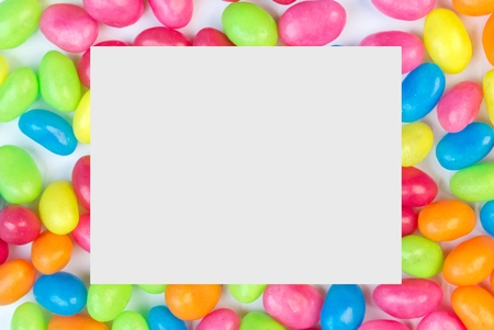 Colorful jelly bean background with white square space for text copy space