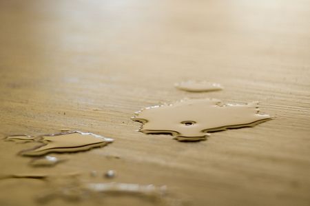 Condensation from a very cold beer on a very hot dayの写真素材