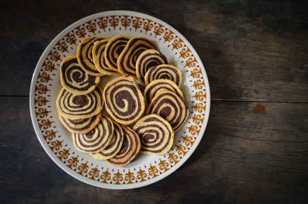 cookie on wood background (left side)の写真素材