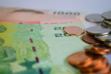 Thai Money: close up of coins and banknotesの写真素材