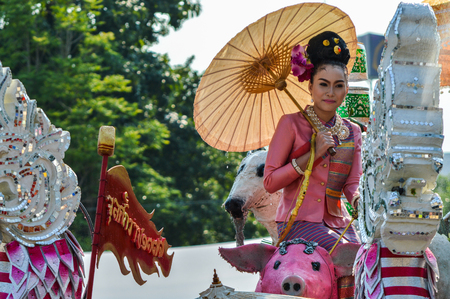 Chiang Rai, Thailand - April 12, 2015 : The Songkran festival parade. Songkran is the holiday known for its water festival. The girl is crowned to be "Miss Songkran"のeditorial素材