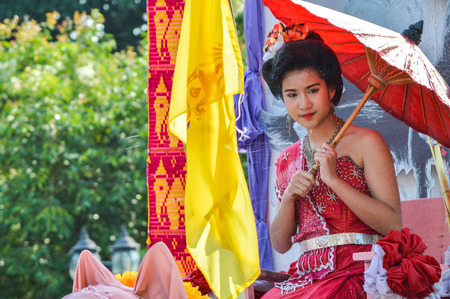 Chiang Rai, Thailand - April 12, 2015 : The Songkran festival parade. Songkran is the holiday known for its water festival. The girl is crowned to be "Miss Songkran"のeditorial素材