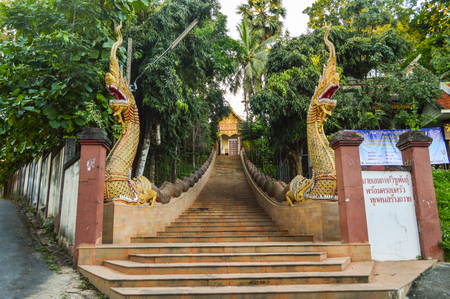 Chiang Rai, Thailand - October 1, 2016: The stairsway to the Wat Phra That Doi Ngam Muang templeのeditorial素材