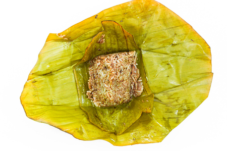 Khao kan chin, it is rice mixed with minced pork and pork blood on steamed banana leaf. On white background.の写真素材