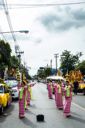 Chiang Rai, Thailand - July 7, 2017 : Candle Festival Parades are paraded around Chiang Rai town.  In Thailand associates with Buddhist agenda called Buddhist Lent. Women dancing in the paradeのeditorial素材