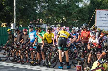 Chiang Rai, Thailand â December 16, 2017 : Tour of Chiang Rai, The cycling touring road event complying with international standard. Singha - Bangkok airways bicycles racing state 3 . Group professional cyclists in the front row ready to start.のeditorial素材
