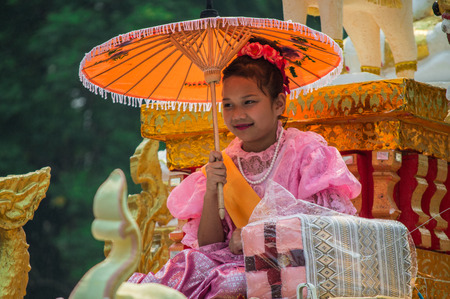 Chiang Rai, Thailand - April 13, 2018 : Songkran festival at Suan Tung Lae Khom Chiang Rai Park in Chiang Rai. The girl is crowned to be "Miss Songkran".のeditorial素材