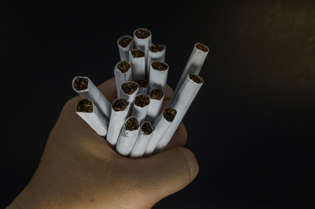 A pack of cigarettes on black backgroundの写真素材