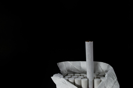 A pack of cigarettes on black backgroundの写真素材