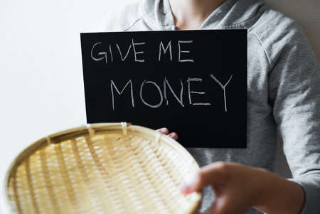 Asian woman asking for moneyの写真素材