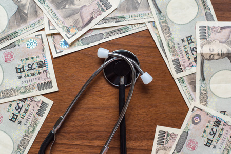 Stethoscope and ten thousands japanese yenの写真素材