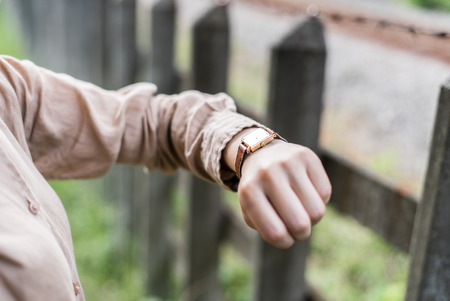 Asian woman looking at her watchの写真素材