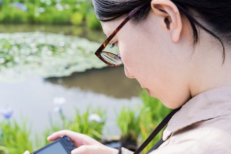 Asian girl take a pictureの写真素材