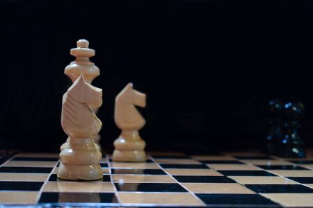 Chess pieces with dark backgroundの写真素材