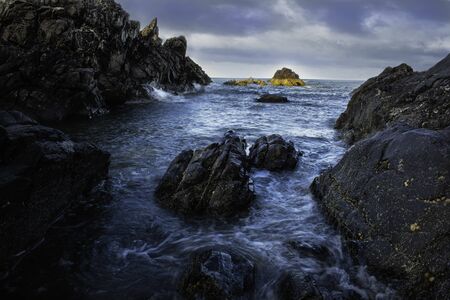Amazing view of the North Sea with beautiful rocks and interesting lights near Stonehaven, Scotlandの写真素材