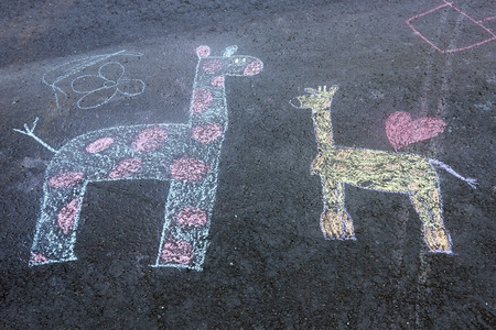 childrenÂ´s drawings on tarmacの写真素材
