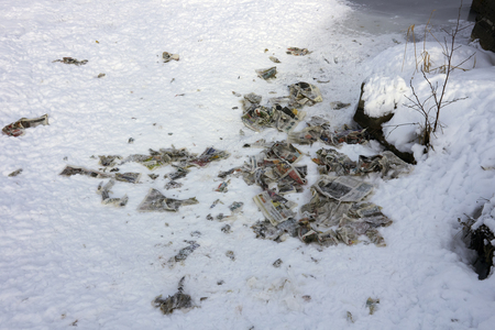 paper trash on snowの写真素材