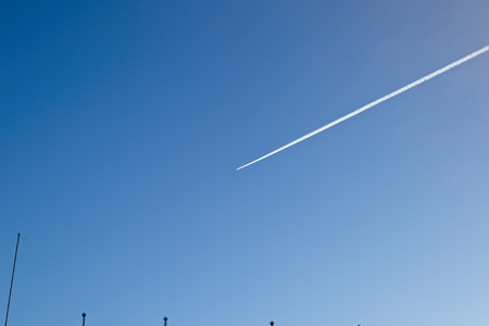 airplane contrail in the skyの写真素材