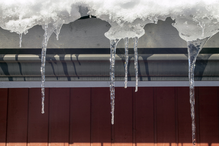 Icicles hanging from house eaves, Finland