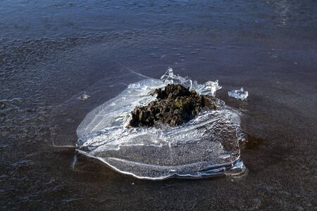 melting ice surface on lake, Finland