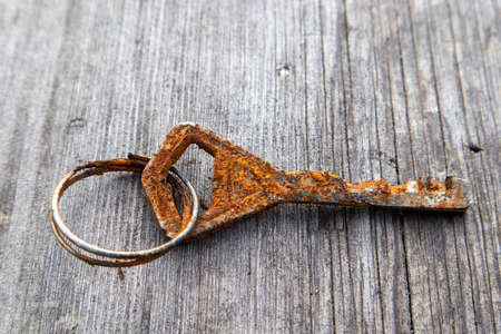 corroded old key on groundの写真素材