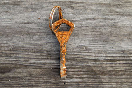 corroded old key on groundの写真素材
