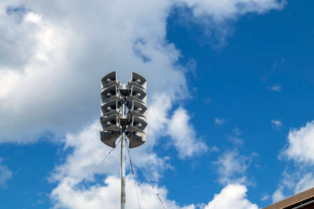 old loudspeakers on a pole outdoors
