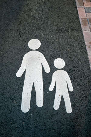 white pedestrian pathway marking on tarmac