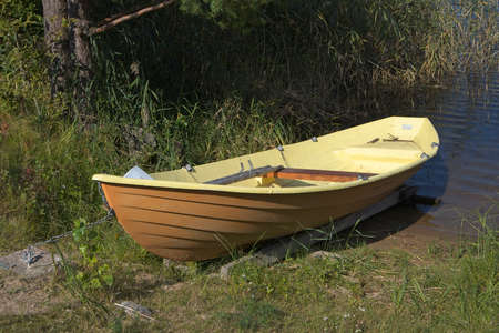 moored rowing boat on a lake shore, Finland