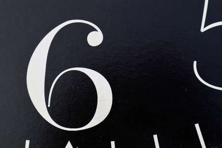 partial clock face with numbers five and sixの写真素材