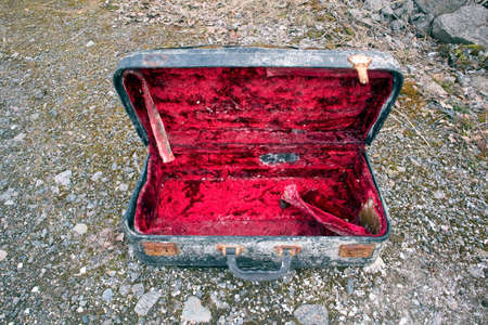 Old abandoned suitcase outdoorsの写真素材