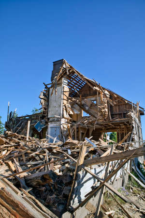 Demolition of an old wooden houseの写真素材