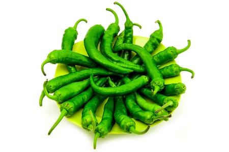 Green cayenne chili pepper in white background    の写真素材
