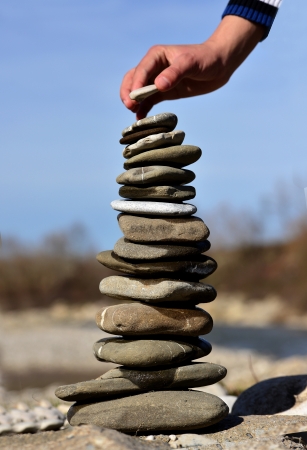 Balanced Stones  Stack of volcanic pebbles on seashoreの写真素材