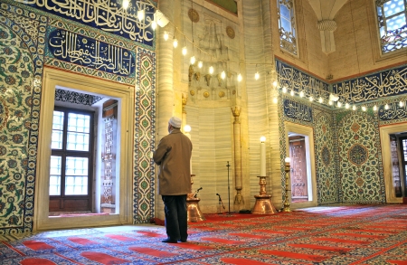 Muslim prayers in the mosque aloneのeditorial素材