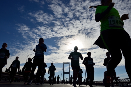 ISTANBUL, TURKEY  NOVEMBER 17  People are crossing the Bosphorus Bridge from Asia to Europe during 35th Istanbul Eurasia Marathon Fun Run on November 17, 2013 in Istanbul, Turkeyのeditorial素材