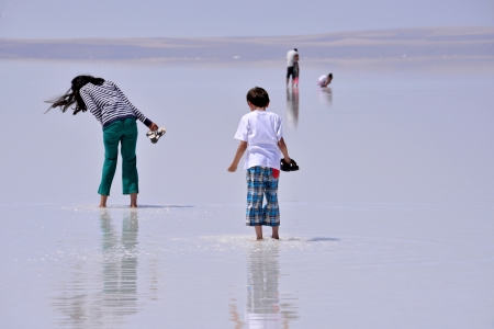 SALT LAKE, TURKEY - JULY 03  People walking at Salt Lake on July 03, 2013 in Aksaray, Turkey  Salt Lake is the second largest lake in Turkeyのeditorial素材