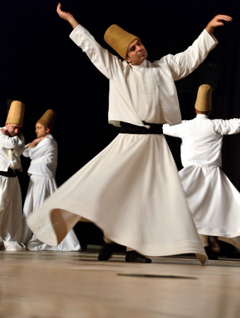 ISTANBUL, TURKEY - DECEMBER 14  Sufi whirling dervish  Semazen  dances, Commemoration of Mevlana Jalaluddin Rumi on December 14, 2013 in Istanbul  Semazen conveys Godのeditorial素材