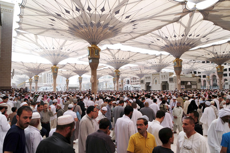 MEDINA SAUDI ARABIA  JAN 30: After Friday prayers Muslims gathered in front of the mosque of the prophet on January 30 2015 in Medina KSA. Nabawi Mosque is the second holiest mosque in Islam and here is Prophet Muhammad is laid to rest.のeditorial素材