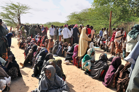DADAAB, SOMALIA - AUGUST 7: Unidentified women and men live in the Dadaab refugee camp hundreds of thousands of Somalis wait for help because of hunger on August 7, 2011 in Dadaab, Somalia.のeditorial素材